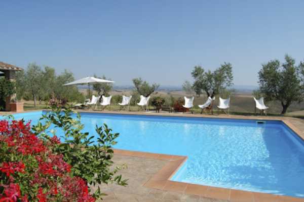 Exclusive huge vacation villa rental with pool in Val'Orcia near Siena. This villa for rent with gym has 9 bedrooms, 8 bathrooms up to 18 sleeps